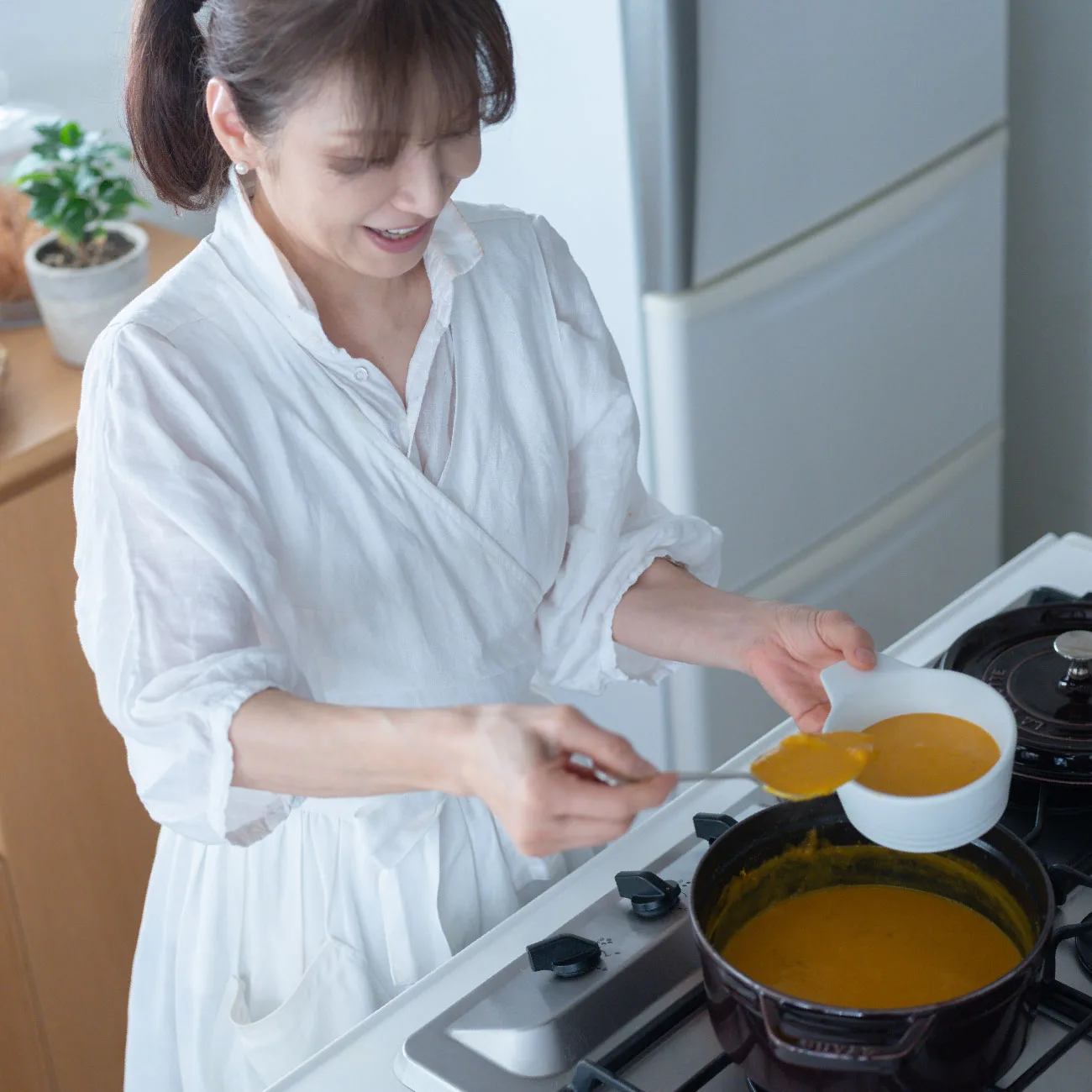 Ms. Izawa preparing Pumpkin Soup