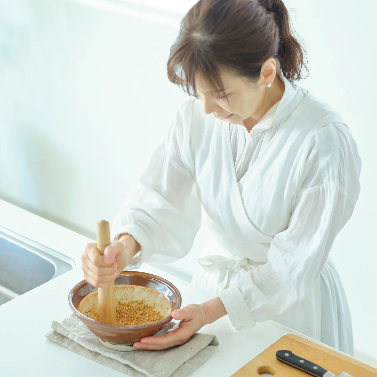 Ms. Izawa preparing Goya and Octopus Shiraae